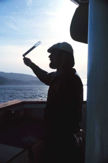 Chief Boatswain Strydr Nutting slings the psychrometer to get wet and dry bulb temperatures. Picture
