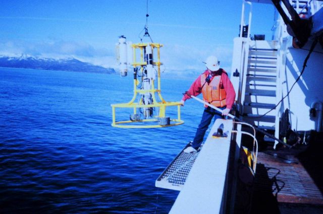 Conductivity-Temperature-Depth rosette being recovered on a rare calm day in western Alaska waters. Picture