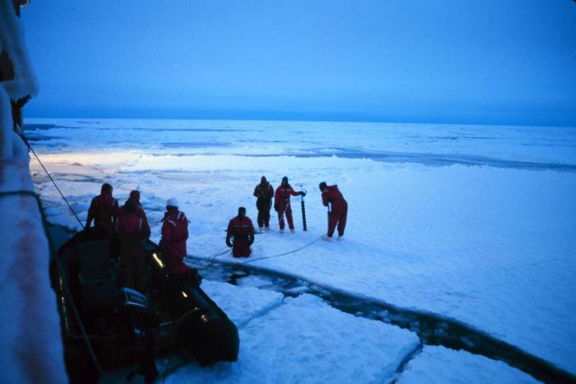 Collecting ice cores to collect biological samples. Picture