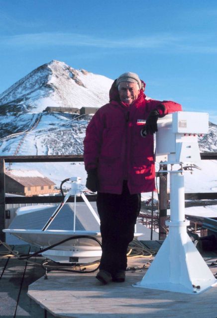 Installing a satellite data receiving antenna on top of the weather building at McMurdo Station Picture