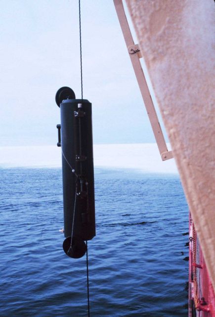 30 liter niskin bottle being lowered over the side of the NATHANIEL B Picture