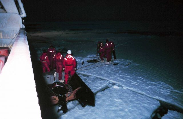 Nighttime operation of collecting thin sea ice cores for analysis. Picture