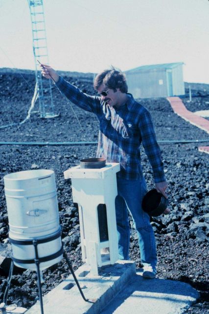 John Bortniak taking rainfall readings at the Mauna Loa Observatory. Picture