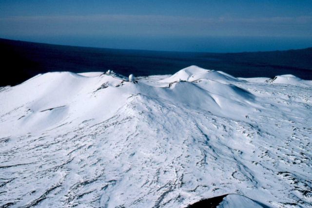 The Mauna Kea astronomical observatories as seen from the air in winter. Picture
