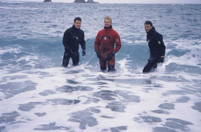 Ensigns Phil Hall, Tom Martin, and Sym Colovos landing zodiacs on beach. Picture