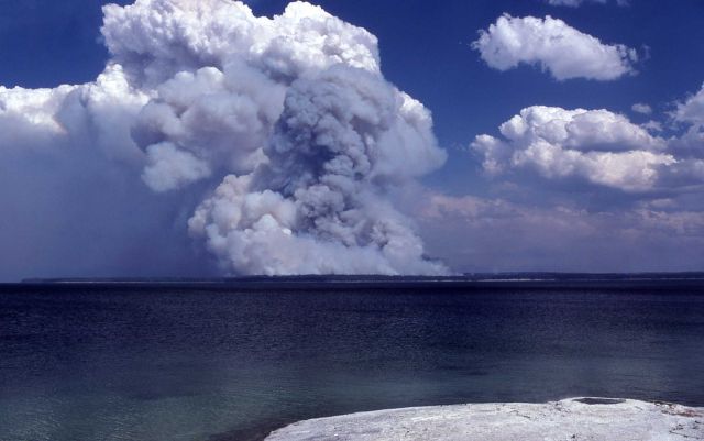 Dark smoke plume from Shoshone fire with Fishing Cone in foreground Picture