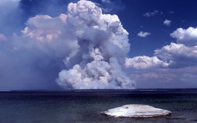 Dark smoke plume from Shoshone fire wih Fishing Cone in foreground Picture
