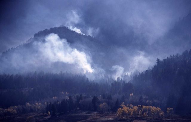 Smoldering fire with yellow aspen trees in burned meadow (possibly Elk Creek) - Smoke Picture
