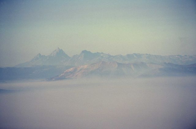 Aerial view above smoke inversion, Mt Sheridan & Grand Tetons in distance Picture
