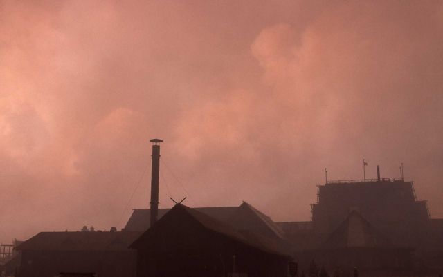 Smoke clouds above Old Faithful Inn Picture