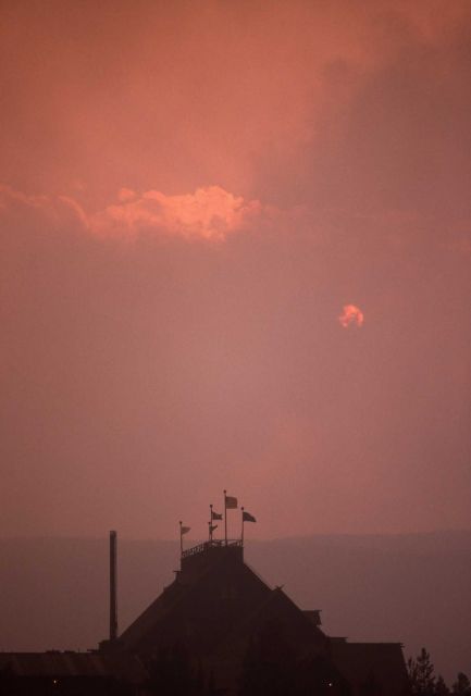 Setting sun through smoke at Old Faithful Inn Picture
