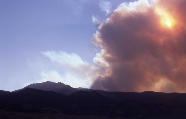 Smoke plume partially blocking out sun behind Electric Peak near north entrance Picture