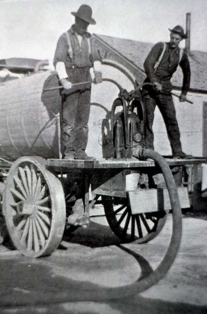 Early water pump wagon used to sprinkle dirt roads Picture