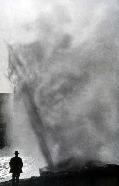 Man watching Riverside Geyser erupting Picture