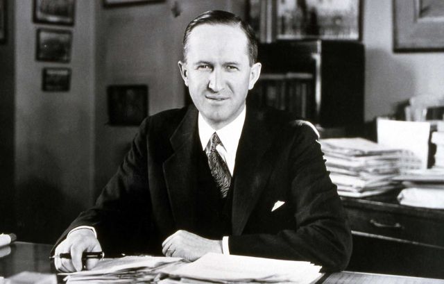 Horace M Albright, National Park Service Director (former Yellowstone Superintendent) sitting at a desk in Mammoth Hot Springs Picture