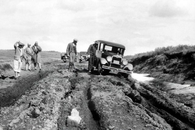 1925 automobile stuck in dirt road Picture