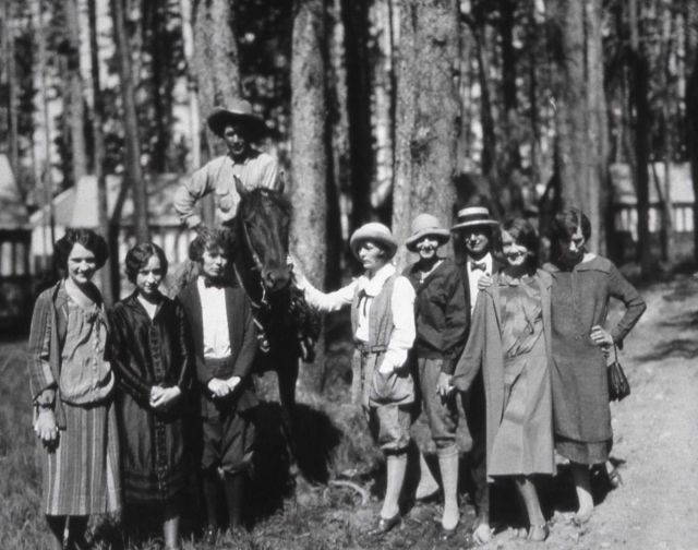 Group of visitors, one on a horse Picture