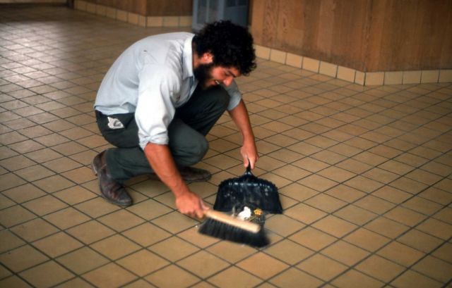 Maintenance worker cleaning up at Old Faithful Visitor Center Picture