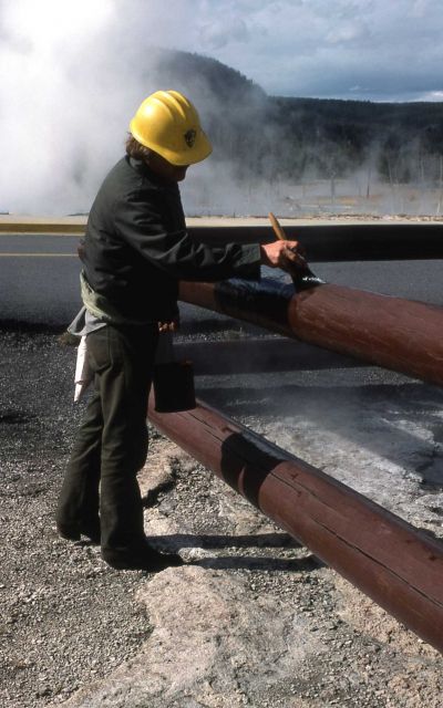 Maintenance worker painting railings Picture