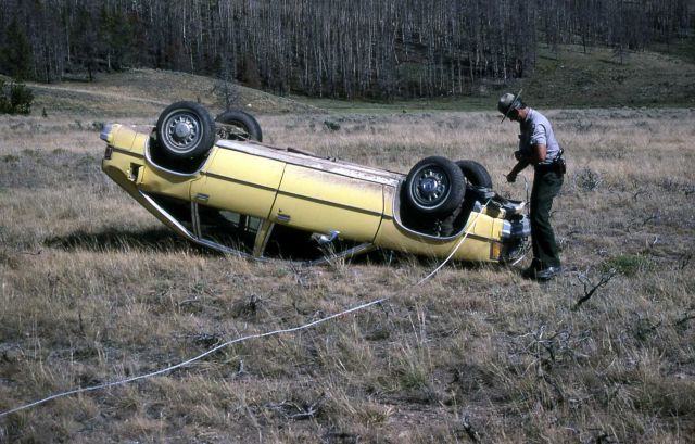 Ranger investigating automobile accident at Swan Lake Flats Picture