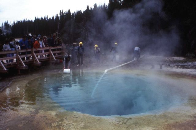 Siphon being used to clean Morning Glory Pool Picture