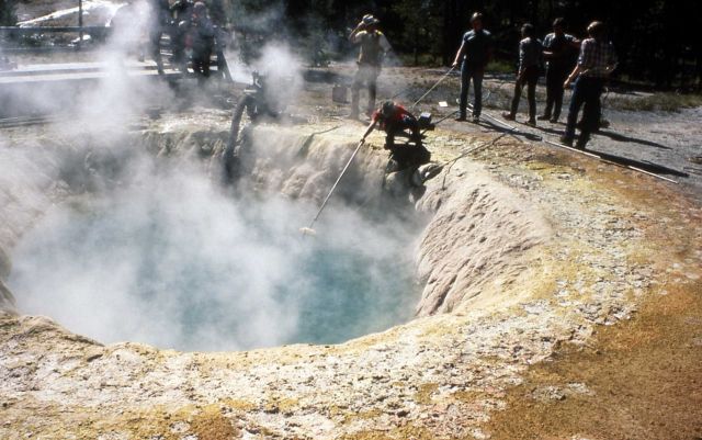 Siphon being used to clean Morning Glory Pool Picture