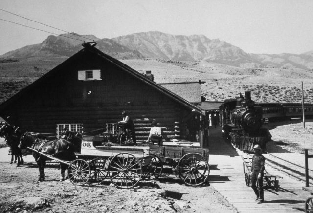 Northern Pacific Railroad station at Gardiner, Montana, train in station, two horse drawn wagons Picture