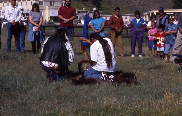 Rocky Afraid of Hawk with son, singing & blessing pipe at bison ceremony Picture