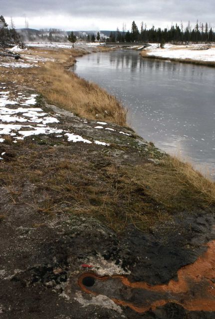 Test hole for new bridge footings on north side of Firehole River near Ojo Caliente (showing hot water flowing out) Picture