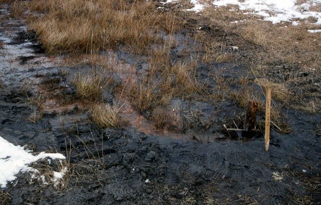 Drilling rig tracks & test hole for bridge footings on southside of Firehole River near Ojo Caliente Picture