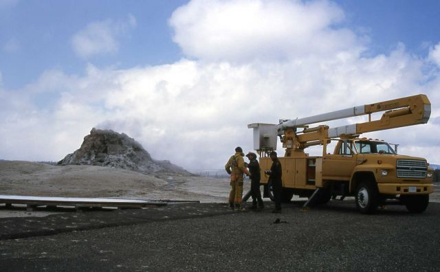 Jim Peaco, Harold Anderson, Willie Burkhardt with bucket truck at White Dome Picture
