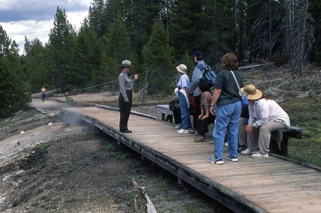 Denise Herman leading an interpretive walk at Norris Geyser Basin (demonstrating proper distance to be kept from animals) Picture