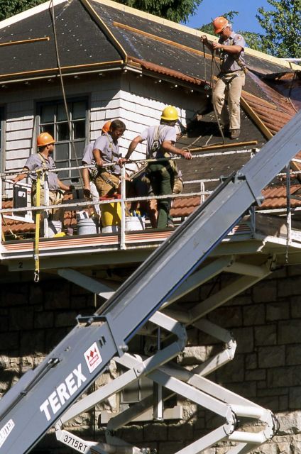 Carpenters reroofing building -2 (duplex) Picture