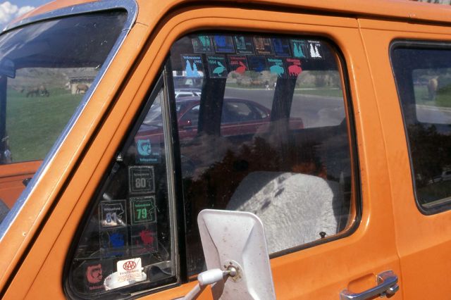 Employee stickers ranging from 1979-1998 on a van window Picture