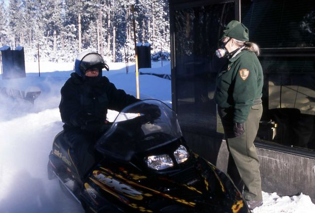 Fee collector wearing a respirator at the West Entrance to Yellowstone National Park Picture