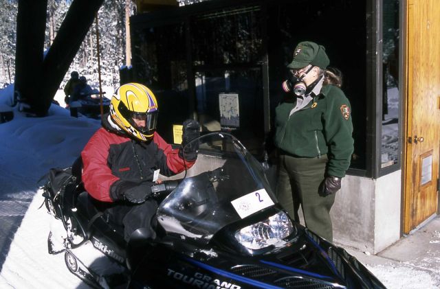 Fee collector wearing a respirator at the West Entrance to Yellowstone National Park Picture