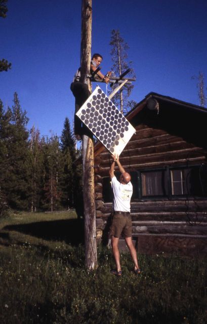 Brad Ross & Bill Hopkins (trail maintenance) putting up solar panel at the Thorofare ranger station Picture