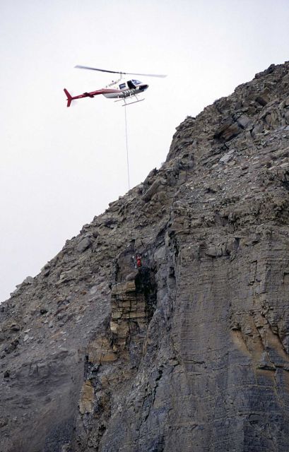 Unloading explosives on Sheep Cliff, to be used to remove unsteady rock after a rock slide Picture