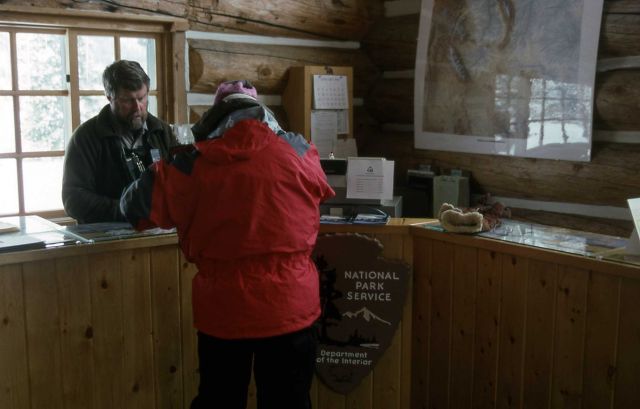 Dave Phillips helping winter visitor at the south entrance ranger station Picture