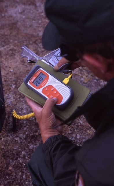 Hank Heasler taking temperature of ground 1
