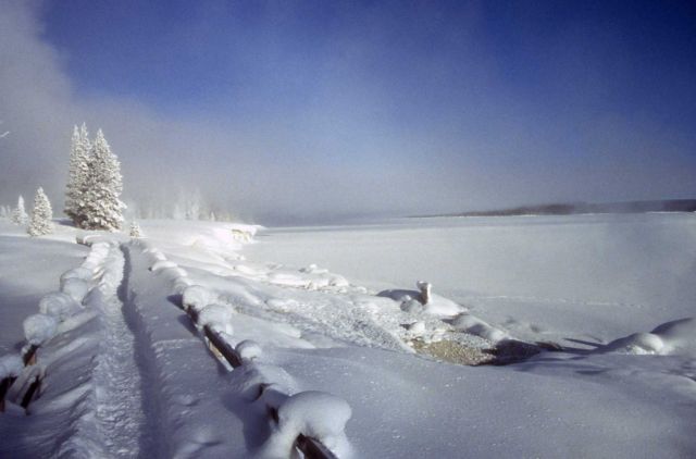 West Thumb Geyser Basin boardwalk covered with snow Picture