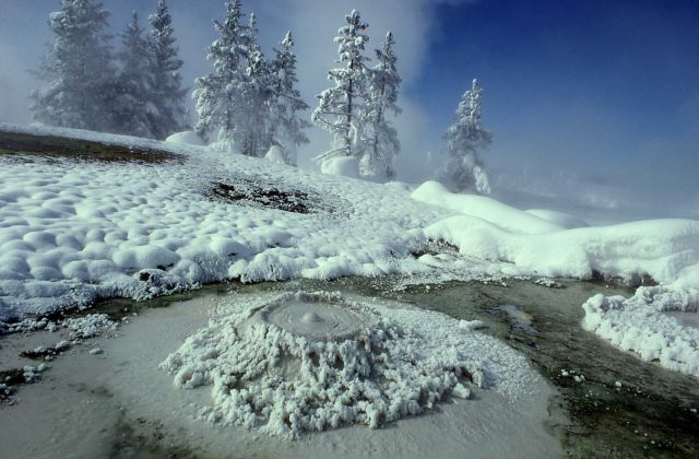 West Thumb Mud Pot surrounded by snow Picture