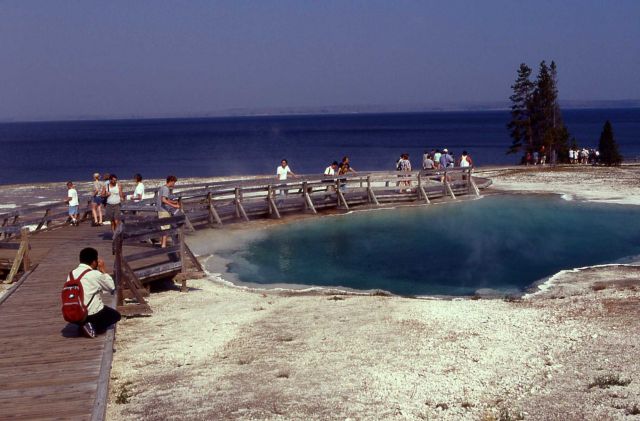 Visitors beside Black Pool, West Thumb Geyser Basin Picture