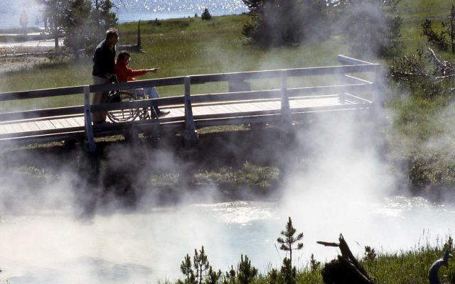 Visitor in wheelchair at West Thumb Picture