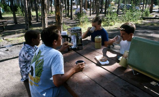 Children eating at picnic table in Grant Village campground Picture