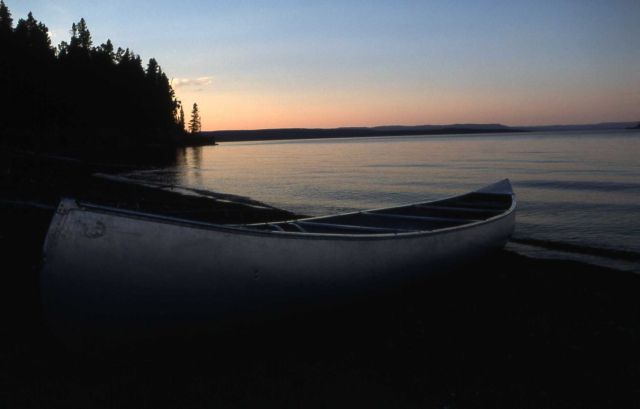 Canoe on lakeshore at backcountry campsite Picture