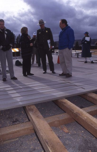 Superintendent Mike Finley with Melinda Sweet & another Unilever representative at the new Old Faithful plastic boardwalk Picture