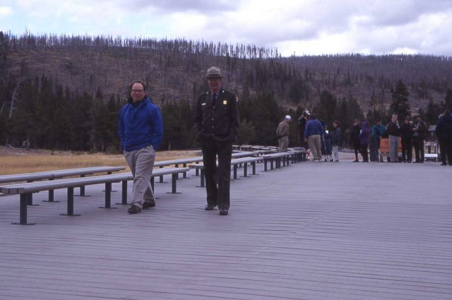 Assistant Superintendent Marv Jensen with Unilever representative on new plastic boardwalk at Old Faithful Picture