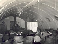 Meeting in Quonset Hut Image