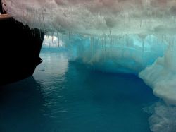 Overhanging edge of a melting ice floe. Image